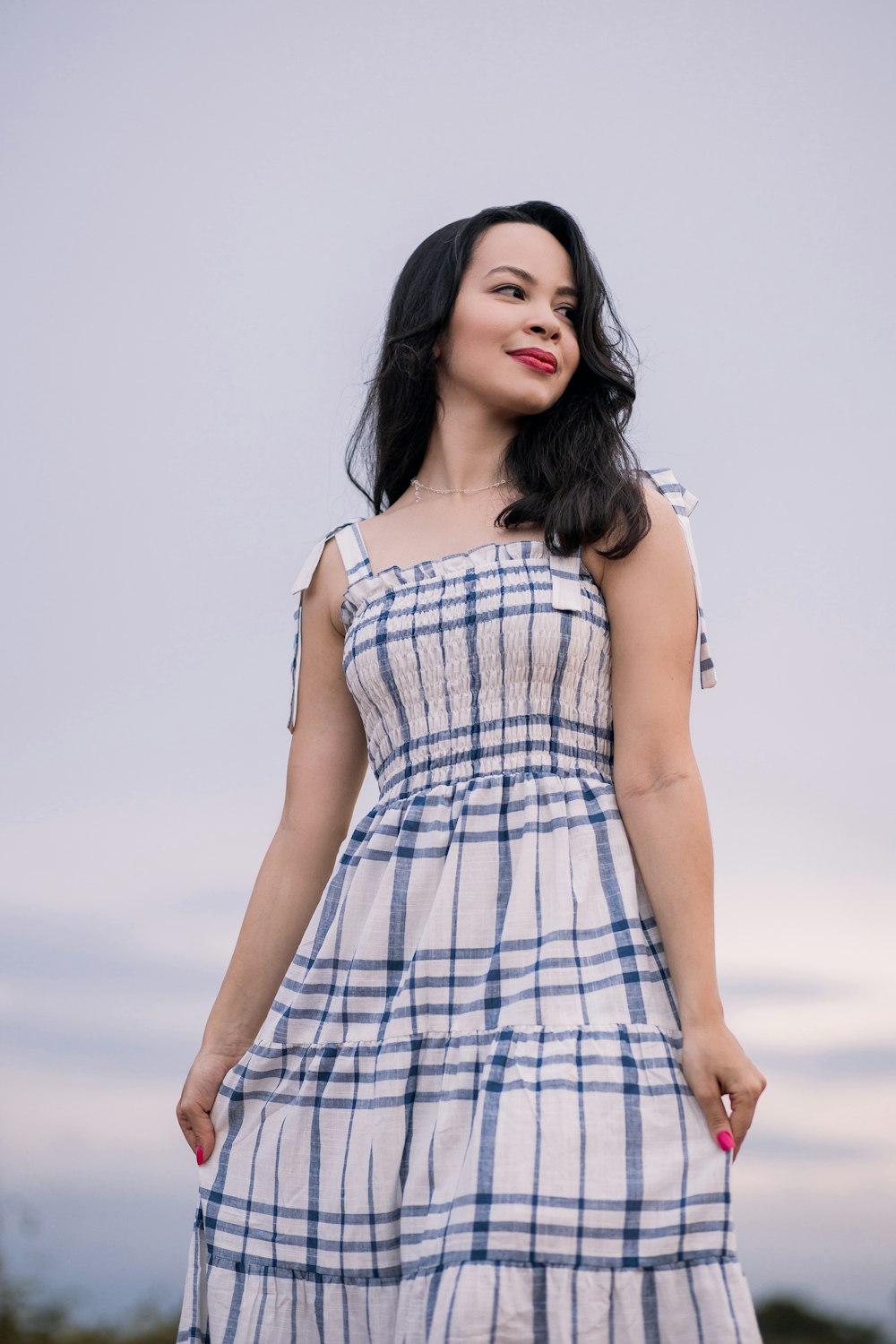 woman in white and black plaid sleeveless dress