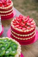 pink and green cake on pink and white table cloth
