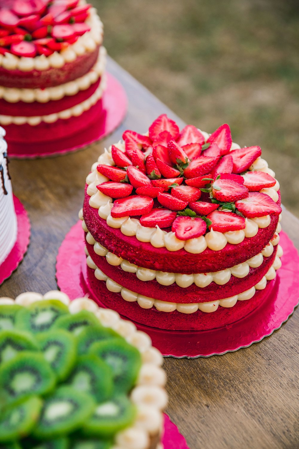 pink and green cake on pink and white table cloth