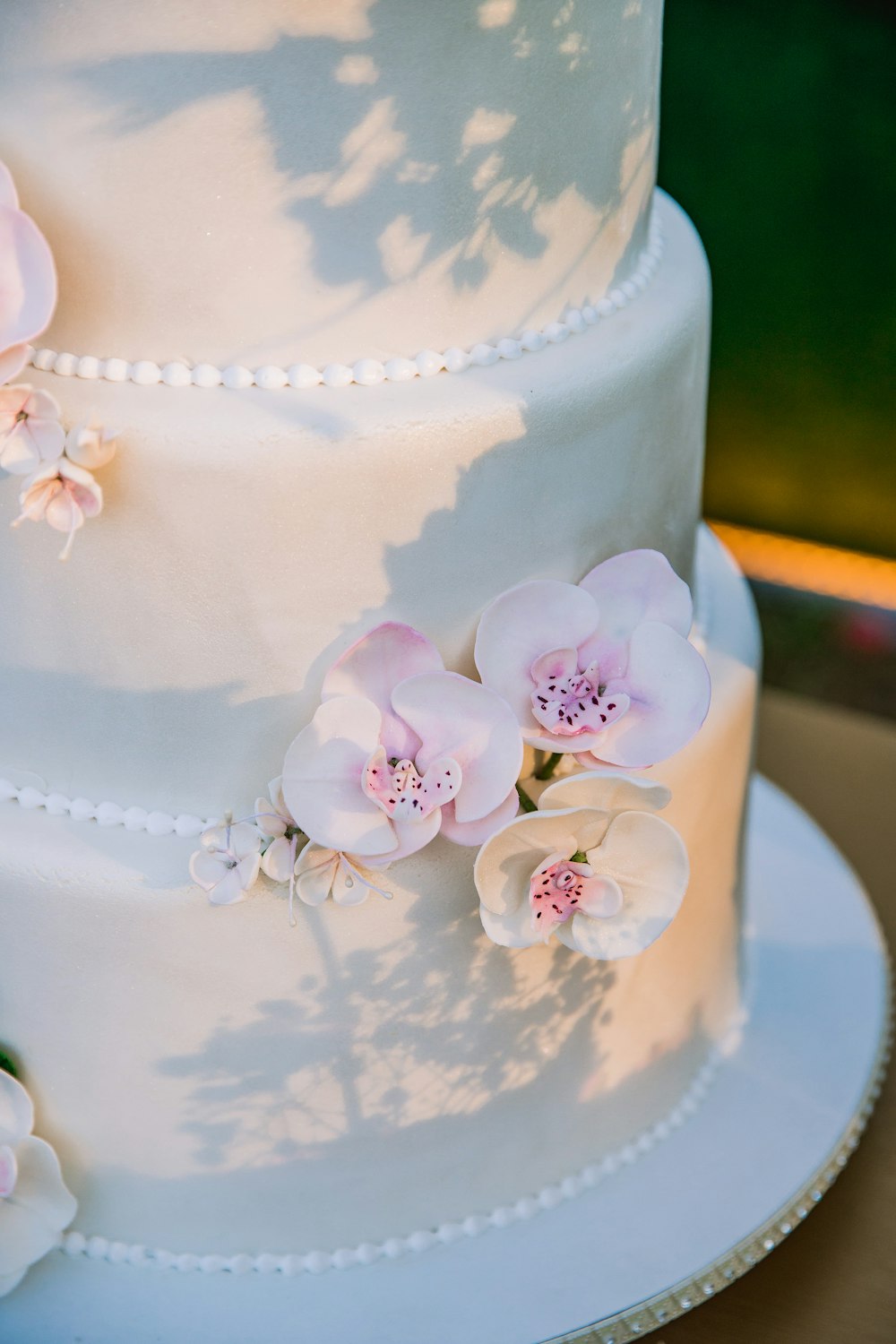 white and pink floral cake