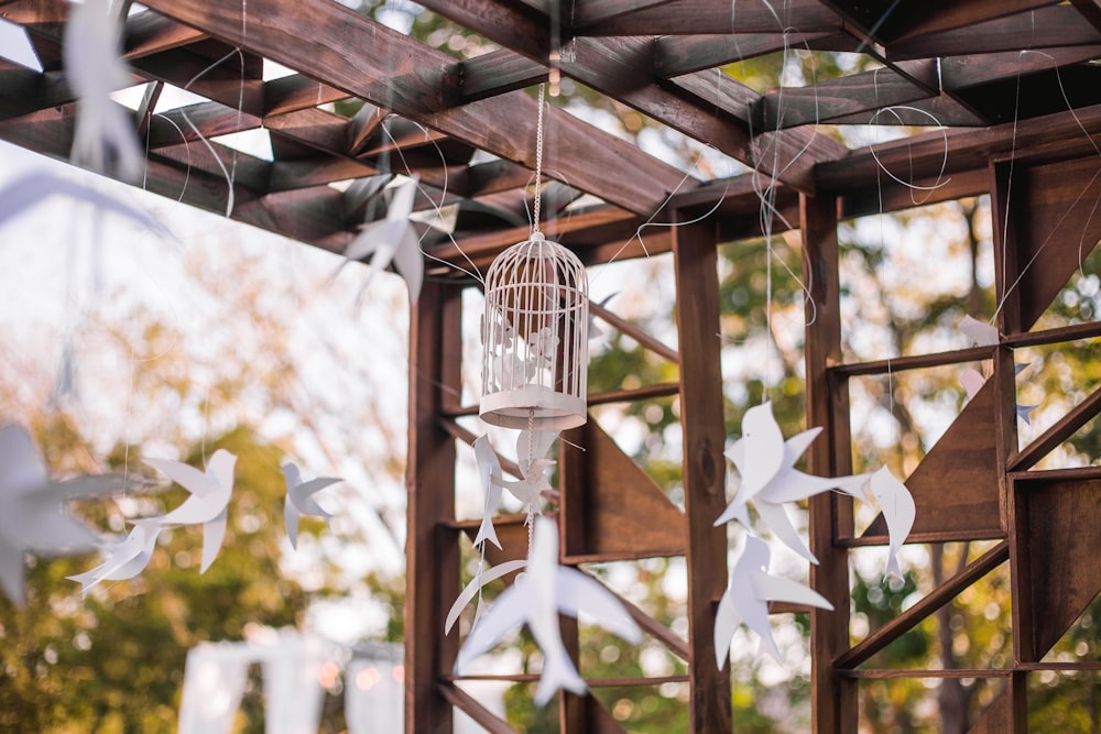 white and brown bird cage