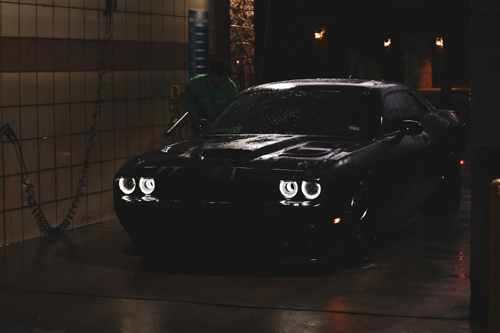 black porsche 911 parked in garage