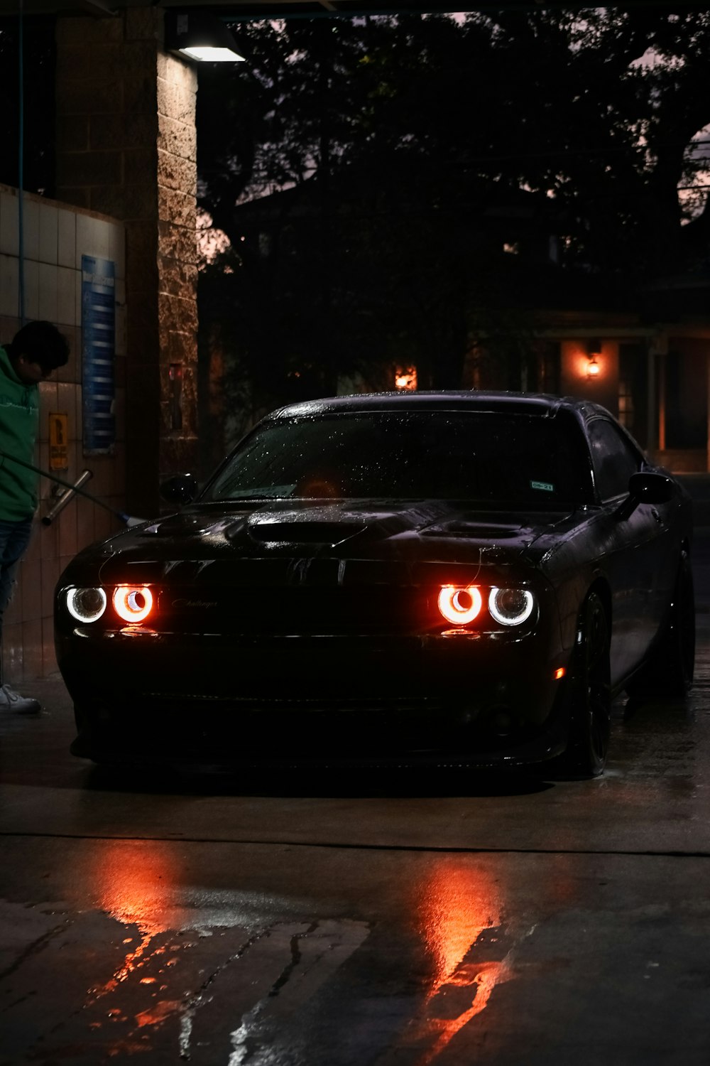 black porsche 911 parked on street during night time