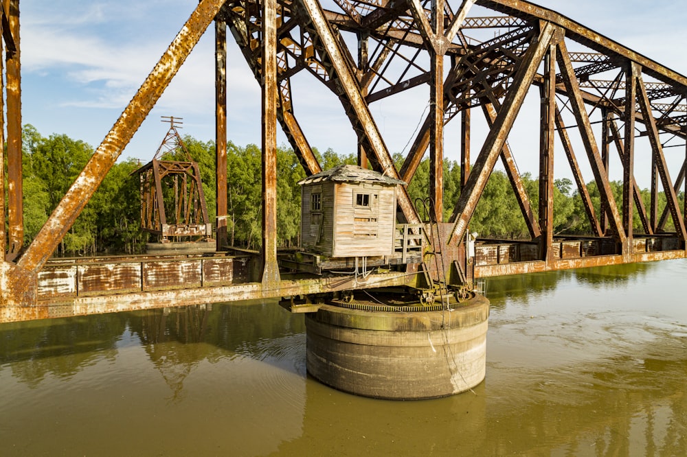 brown wooden bridge over river during daytime