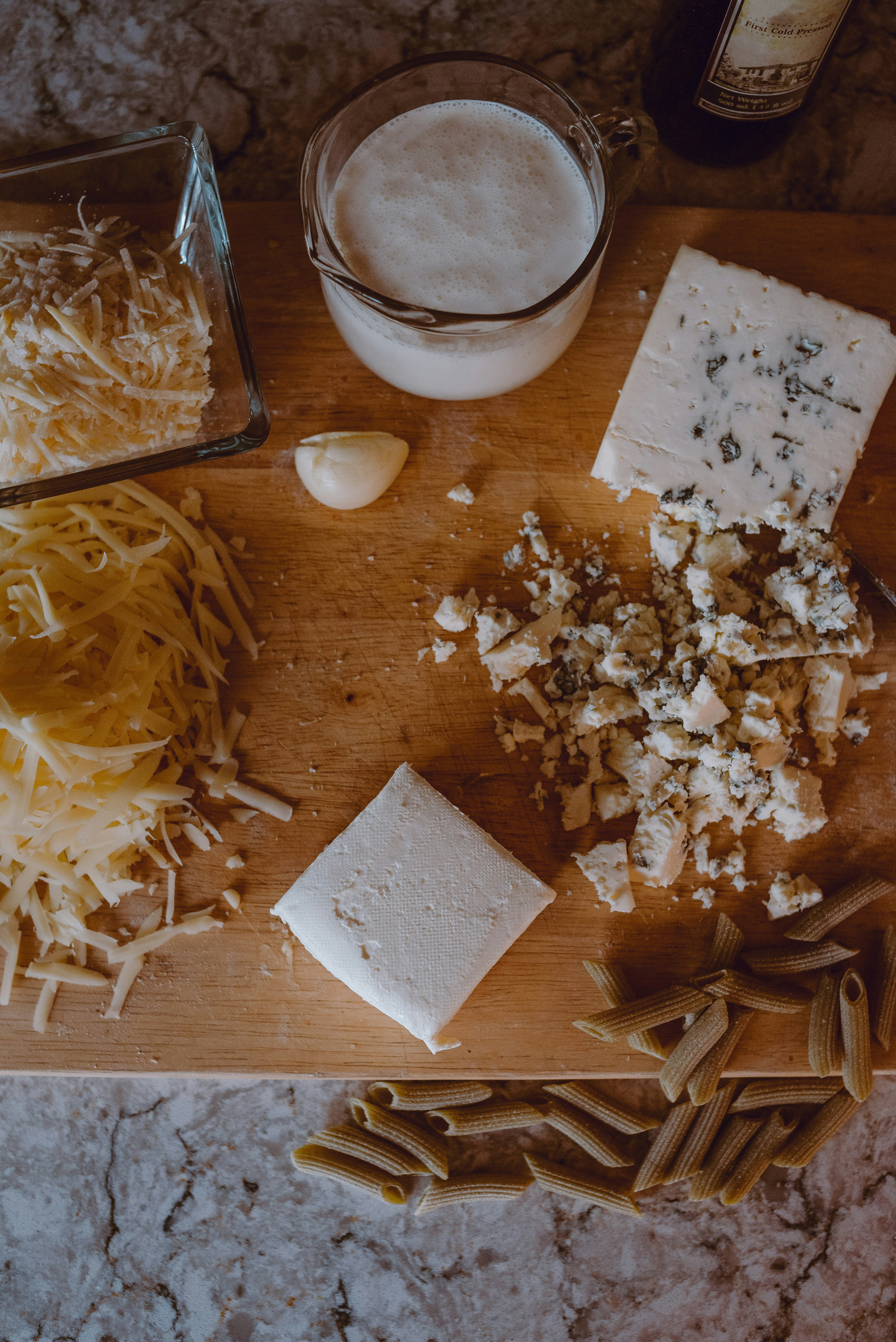 Overhead View of the Ingredients for a Cheese Sauce on a Cutting Board