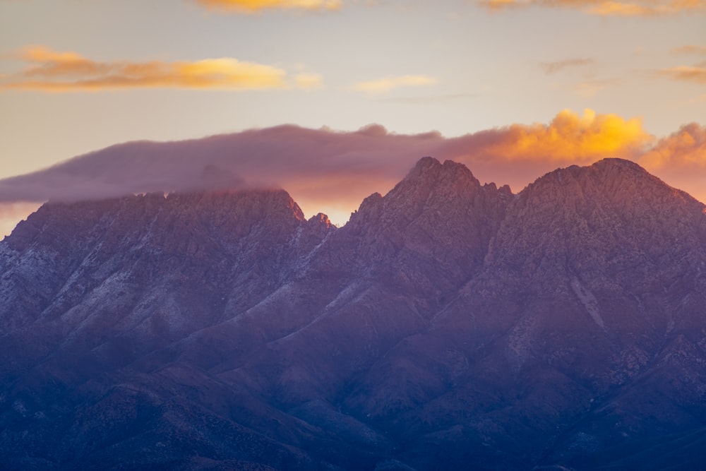 black and white mountains under white clouds during daytime