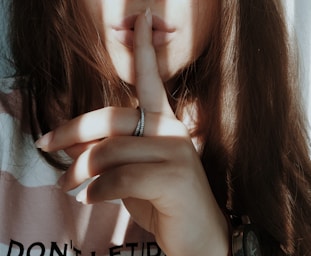 woman wearing silver ring and bracelet
