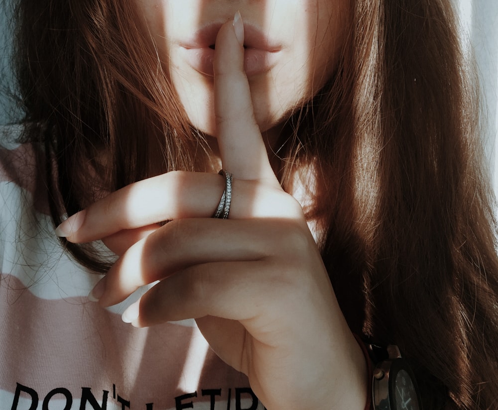 woman wearing silver ring and bracelet