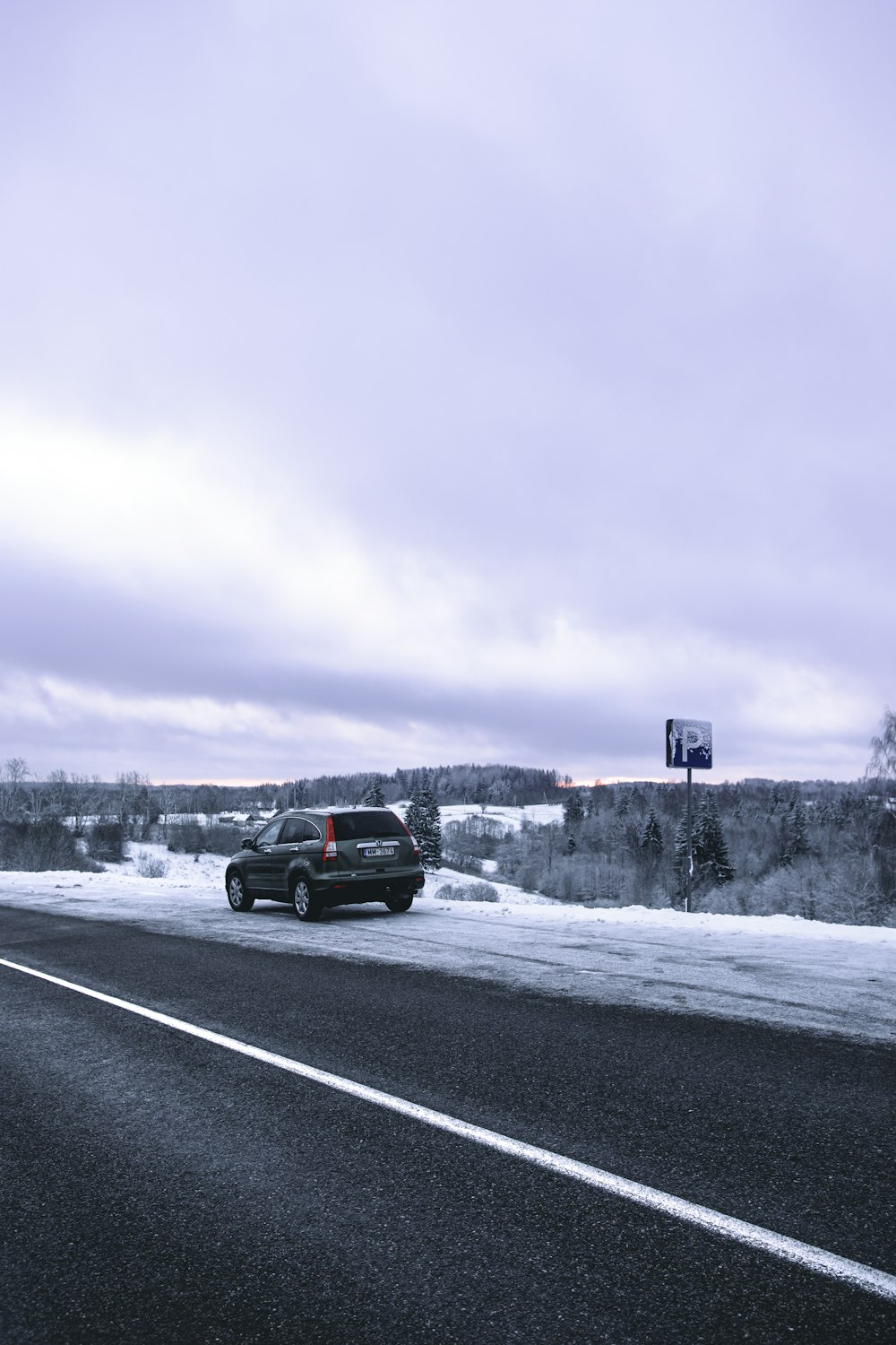 black suv on road during daytime