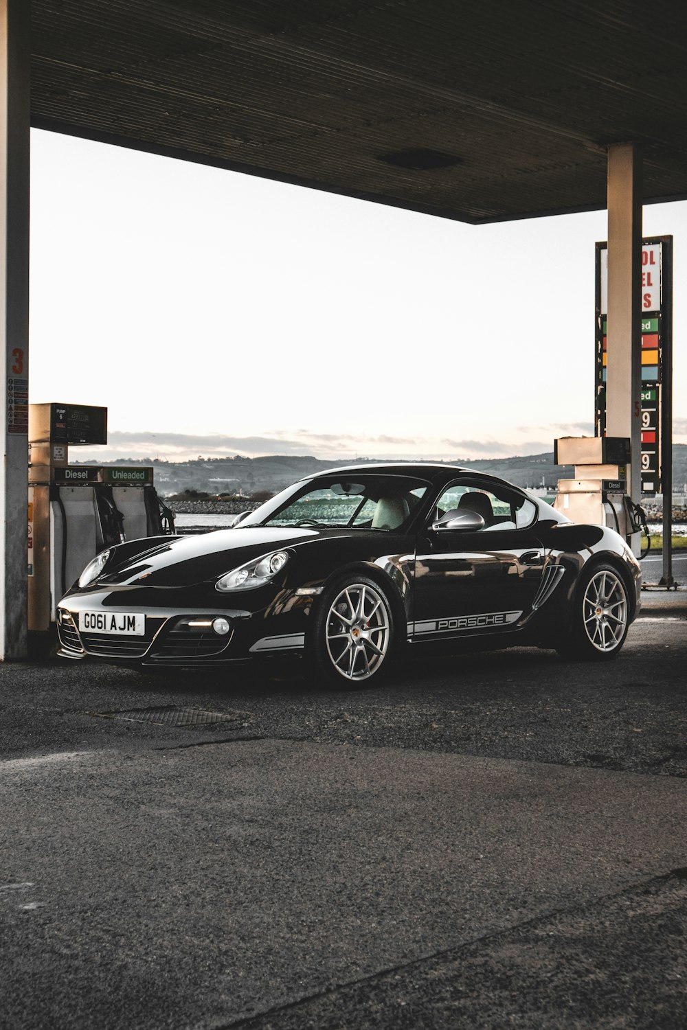 black porsche 911 parked on parking lot during daytime