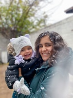 2 women smiling while taking photo