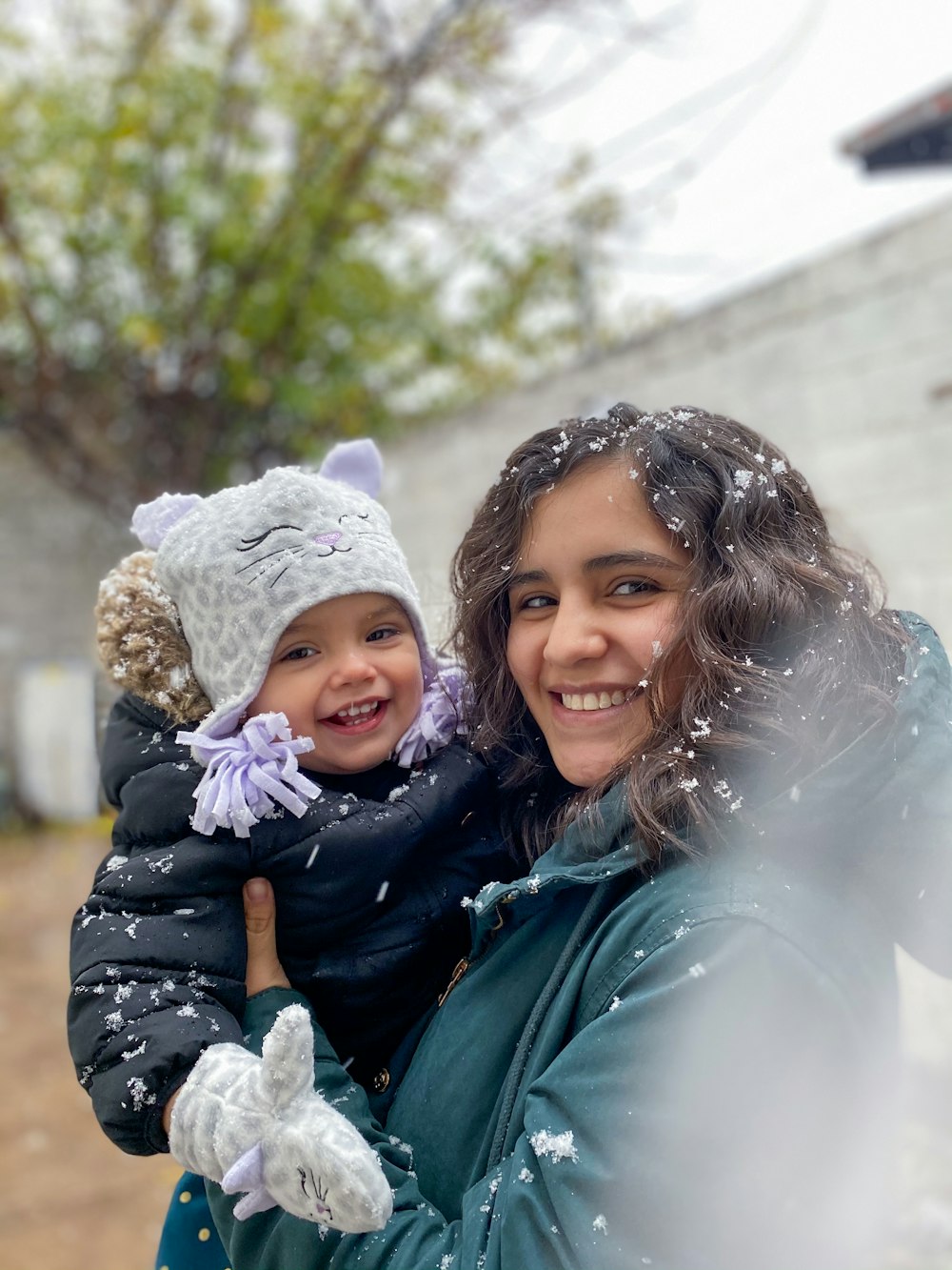 2 women smiling while taking photo