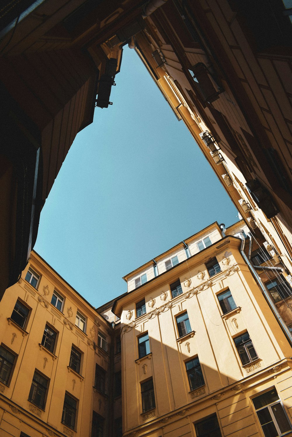 brown concrete building under blue sky during daytime