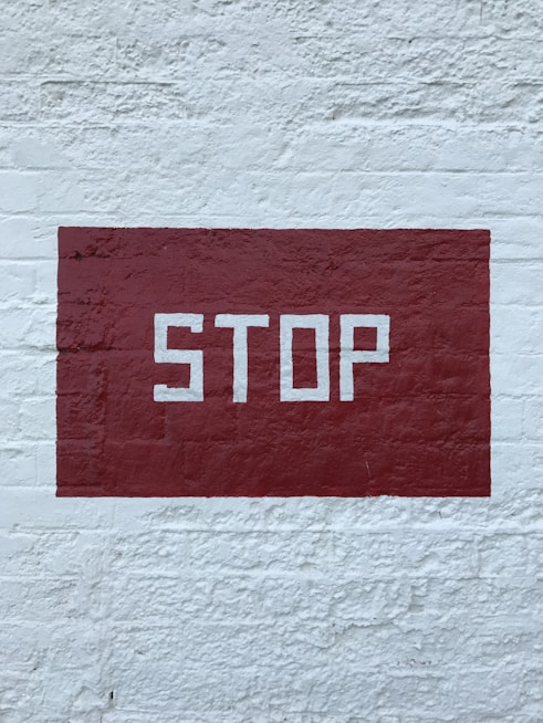 red and white no smoking sign