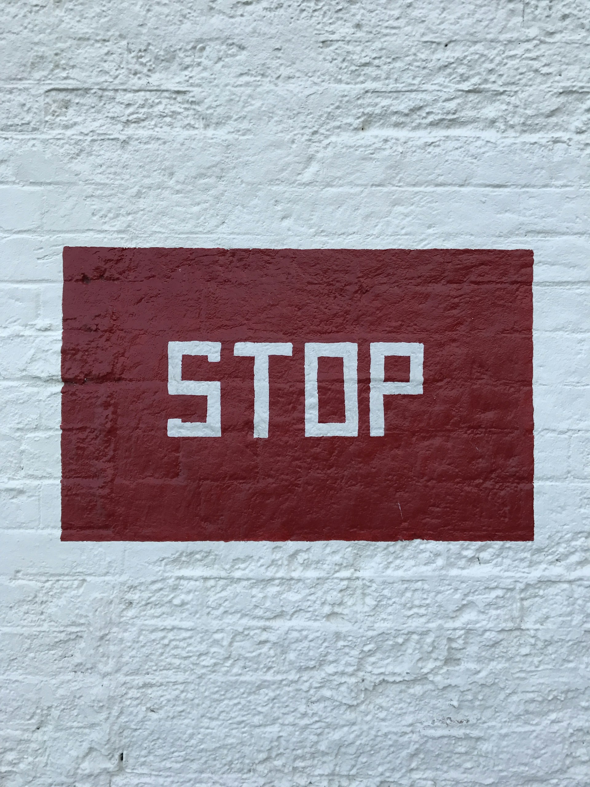 red and white no smoking sign