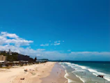 A group of friends enjoying a sunny day at a famous Australian beach.