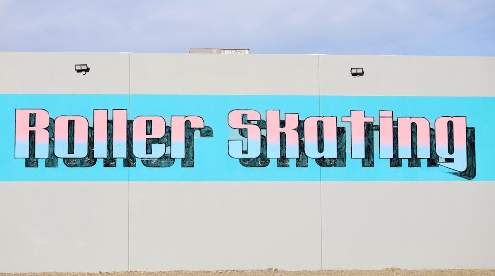 a large sign on the side of a building that says roller skating