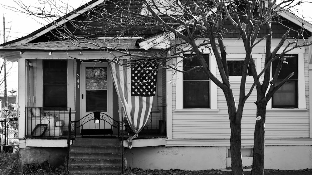 grayscale photo of a house with a window