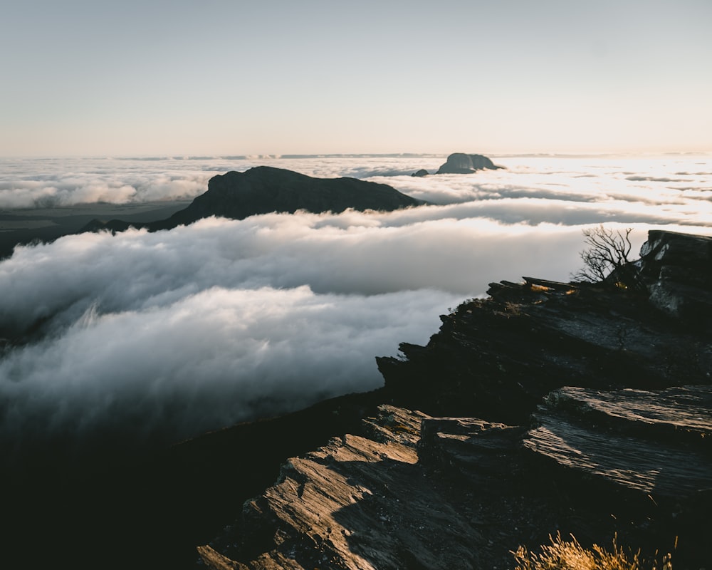 black and white mountains under white clouds