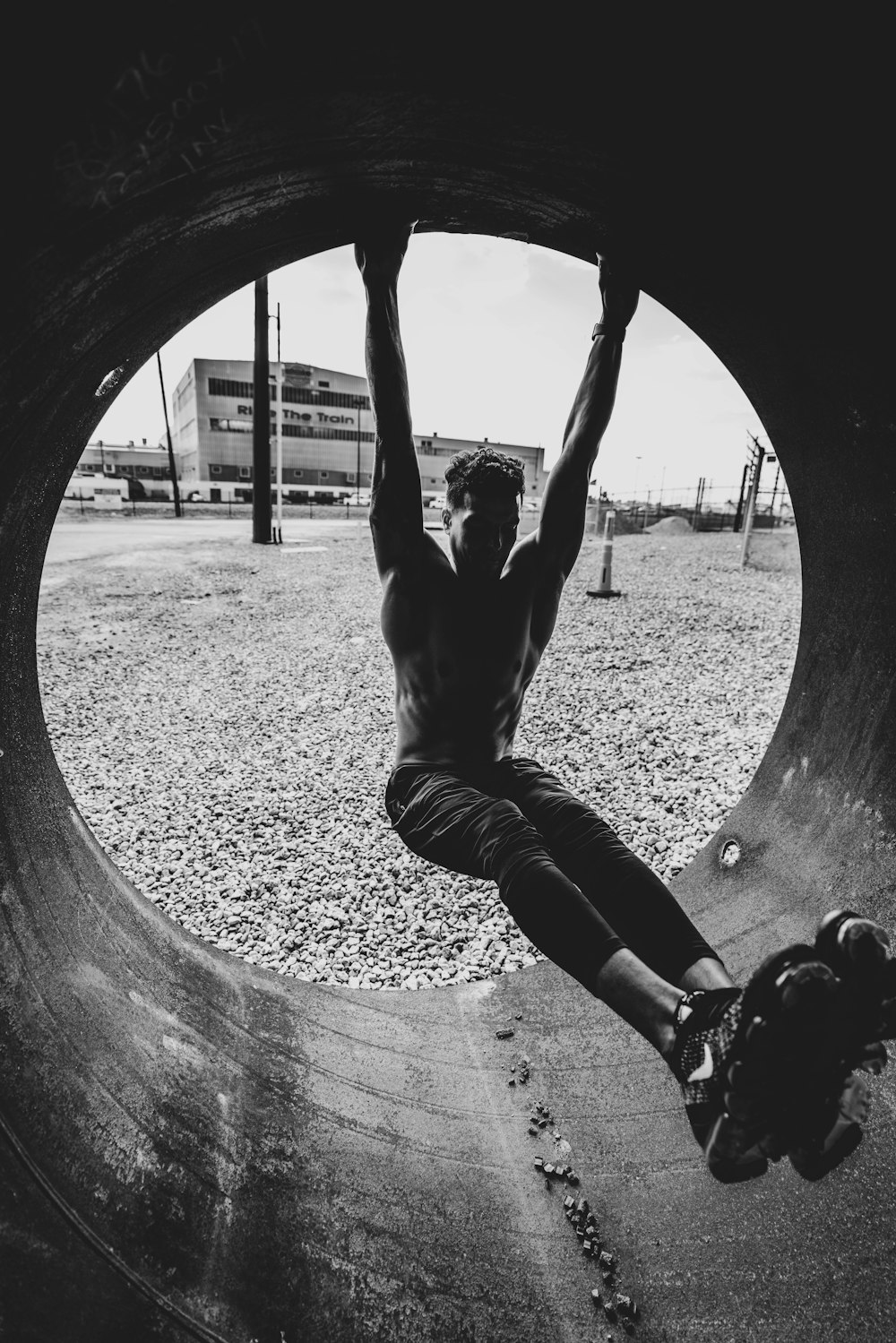 man in black t-shirt and black pants jumping on air