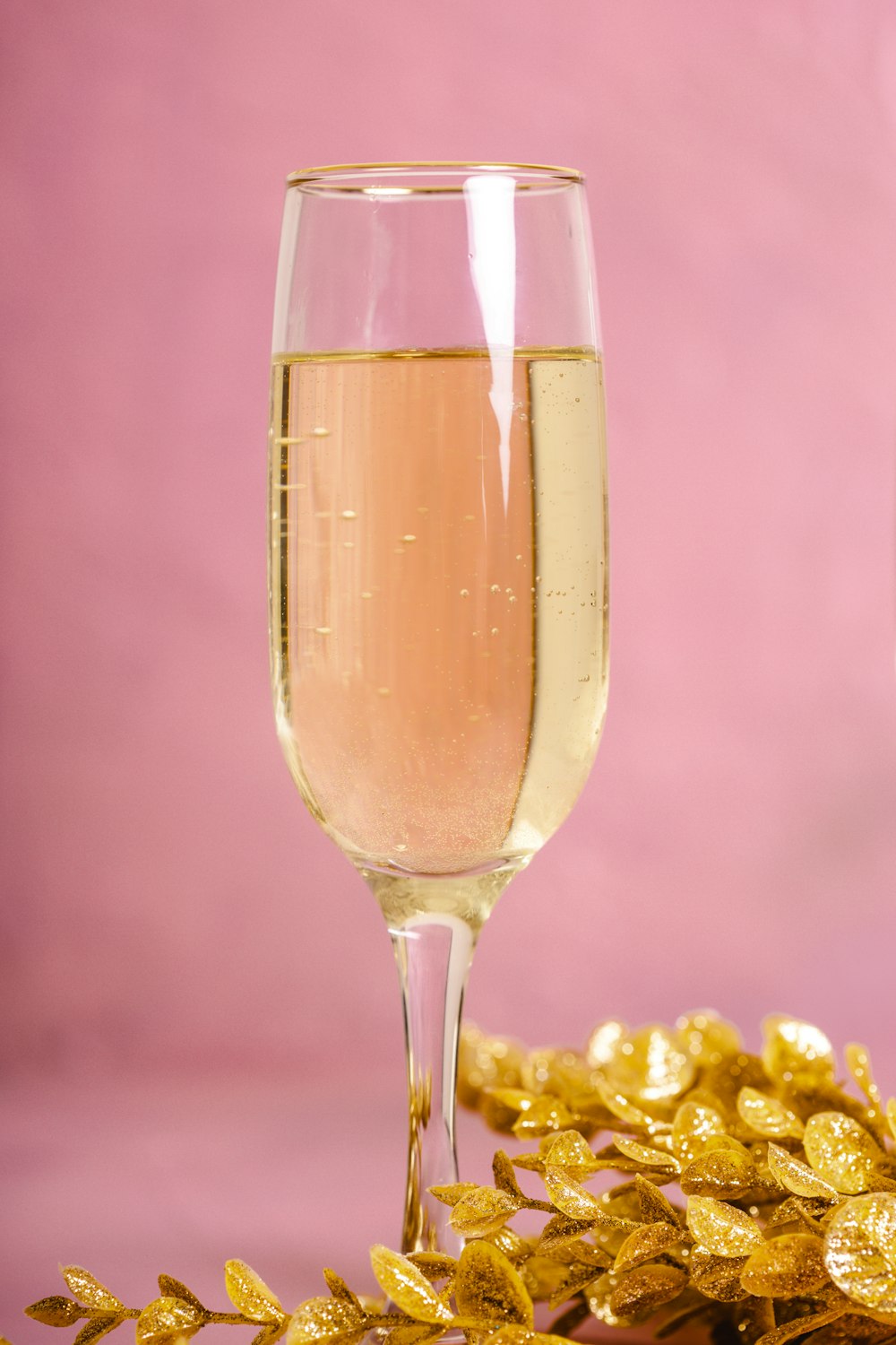 clear wine glass with brown liquid