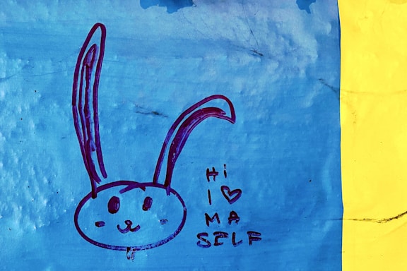 A cheerful illustration of Leo the lion and Alice the girl waving hello together.