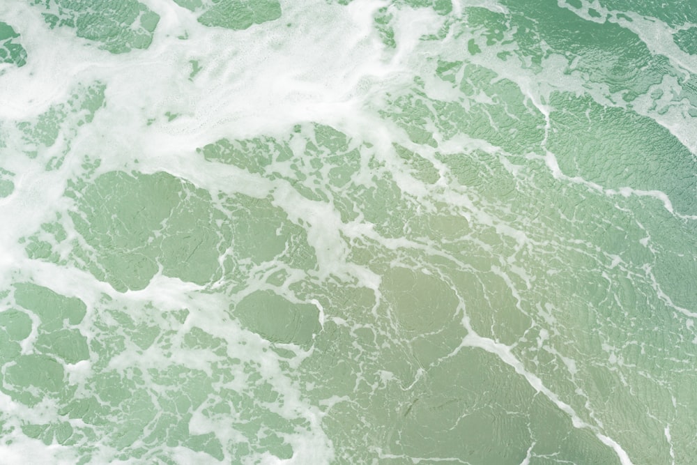 green and white water waves