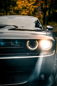 silver car with white and black lights