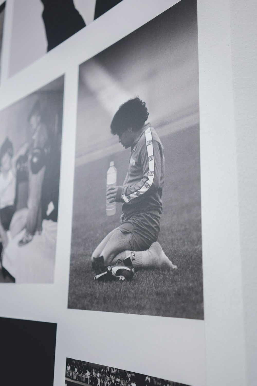 man in black and white striped long sleeve shirt sitting on ground