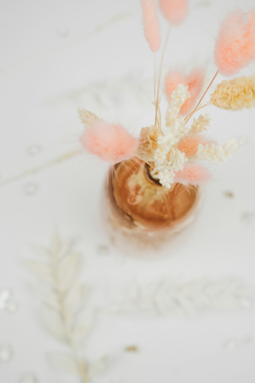 brown and white flower on white and brown ceramic vase