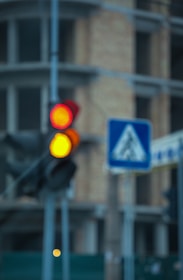 A blurred image of a construction site with a 'Coming Soon' sign.