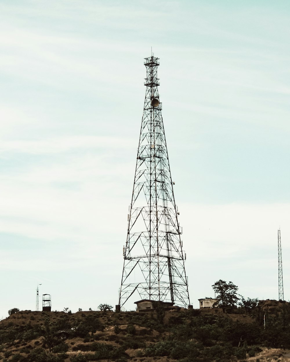 gray metal tower under blue sky during daytime