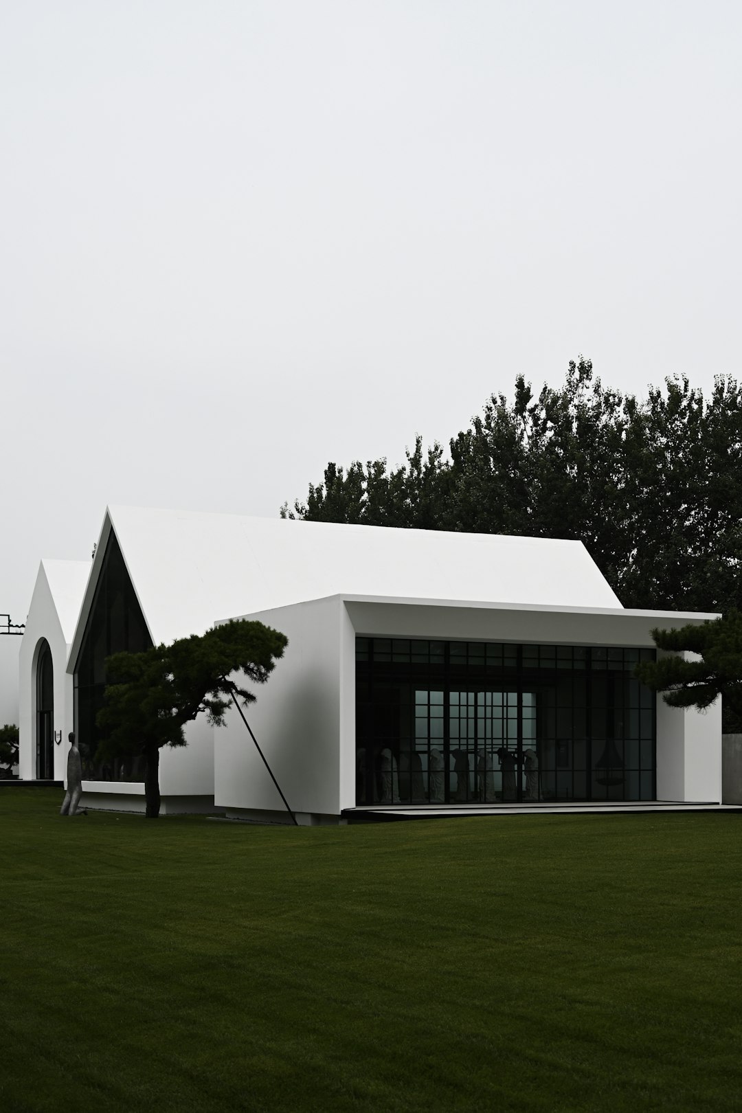 white concrete building near green grass field during daytime