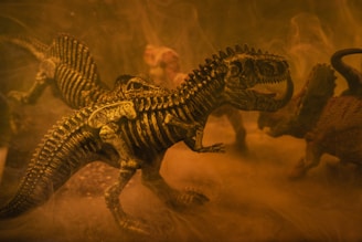 black and brown dinosaur toy