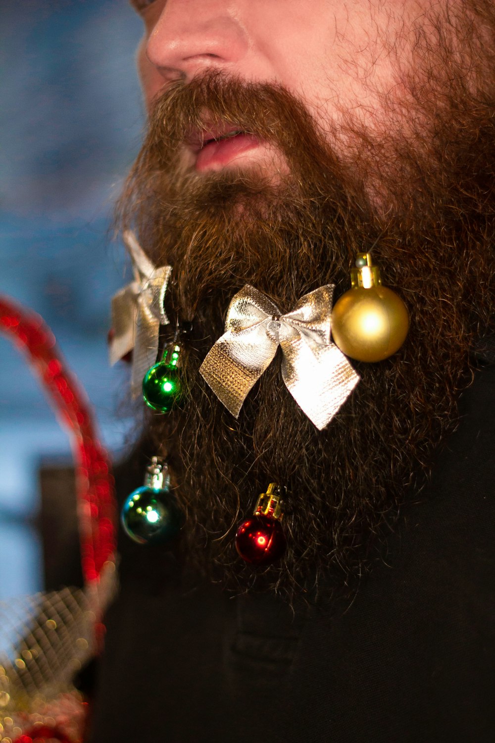 man with gold and silver ribbon on his head