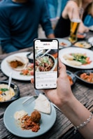 person holding white and black labeled box
