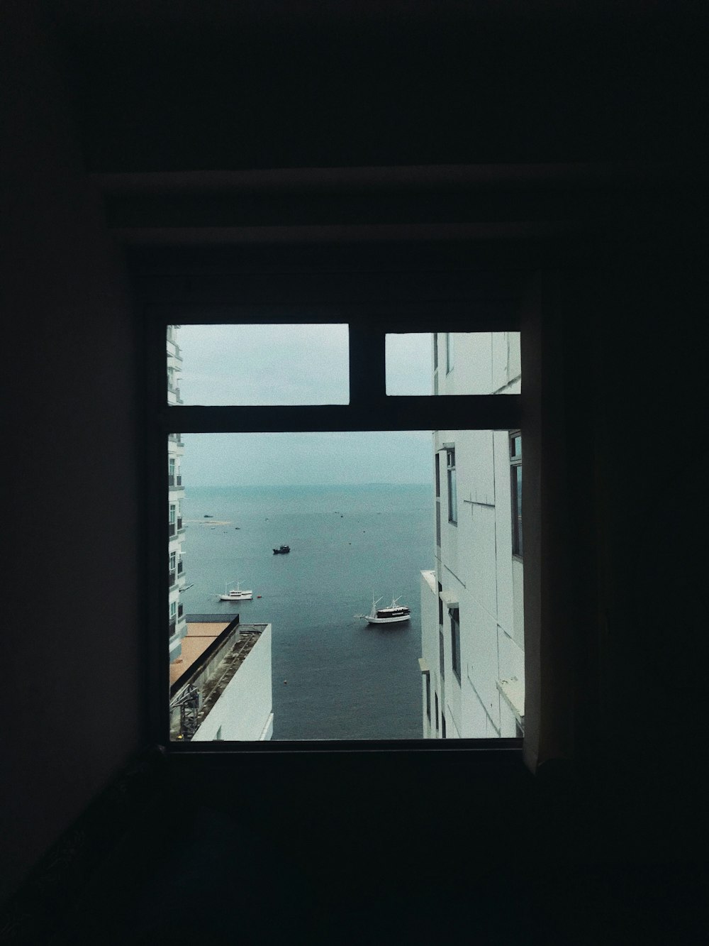 white and black boat on sea during daytime