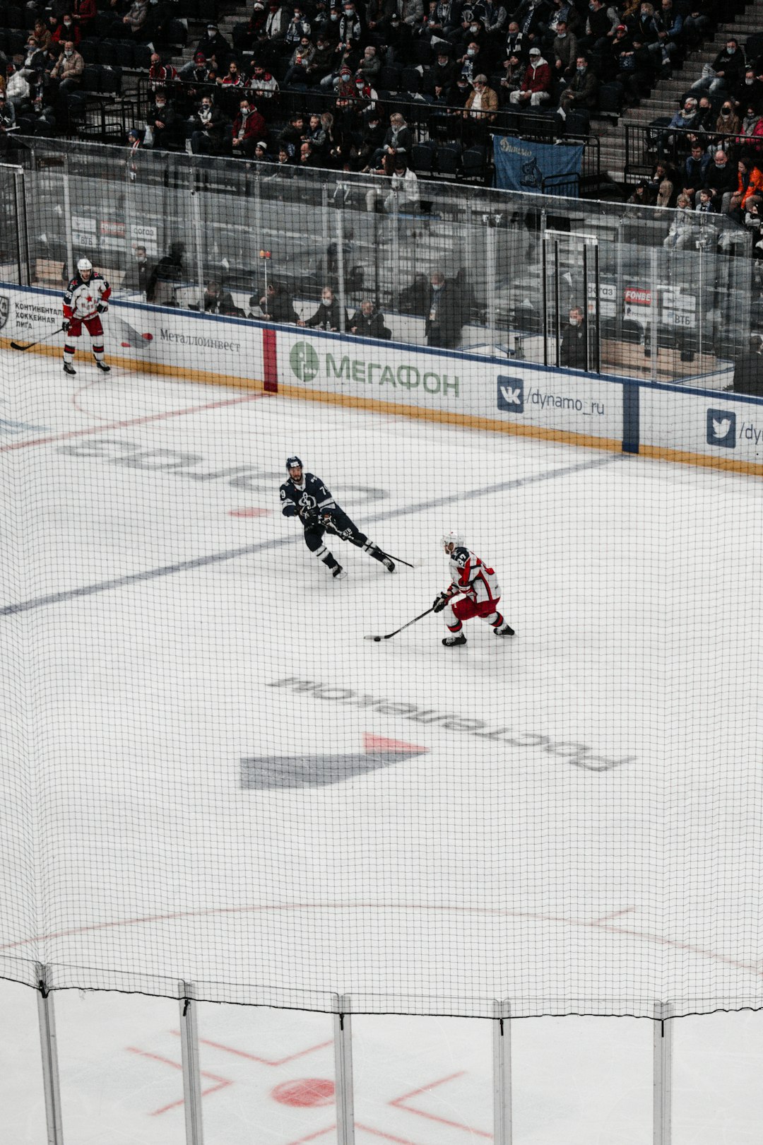 man in red and white hockey jersey playing hockey