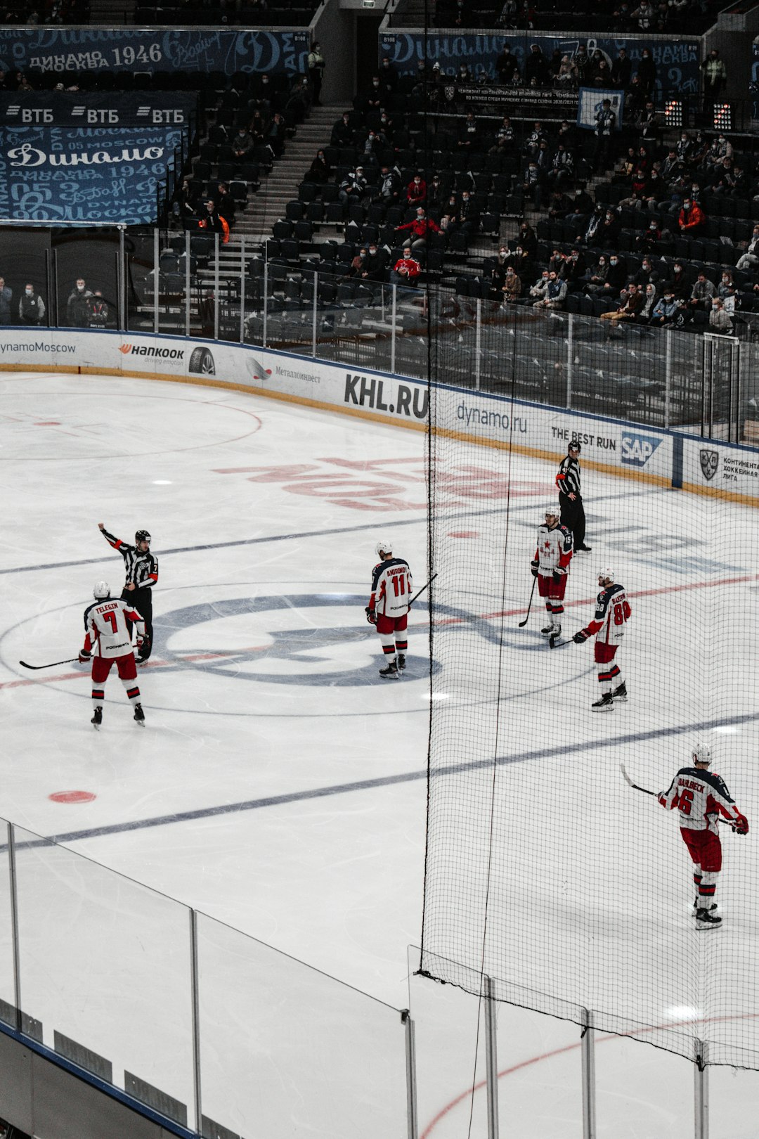 people playing ice hockey on ice stadium