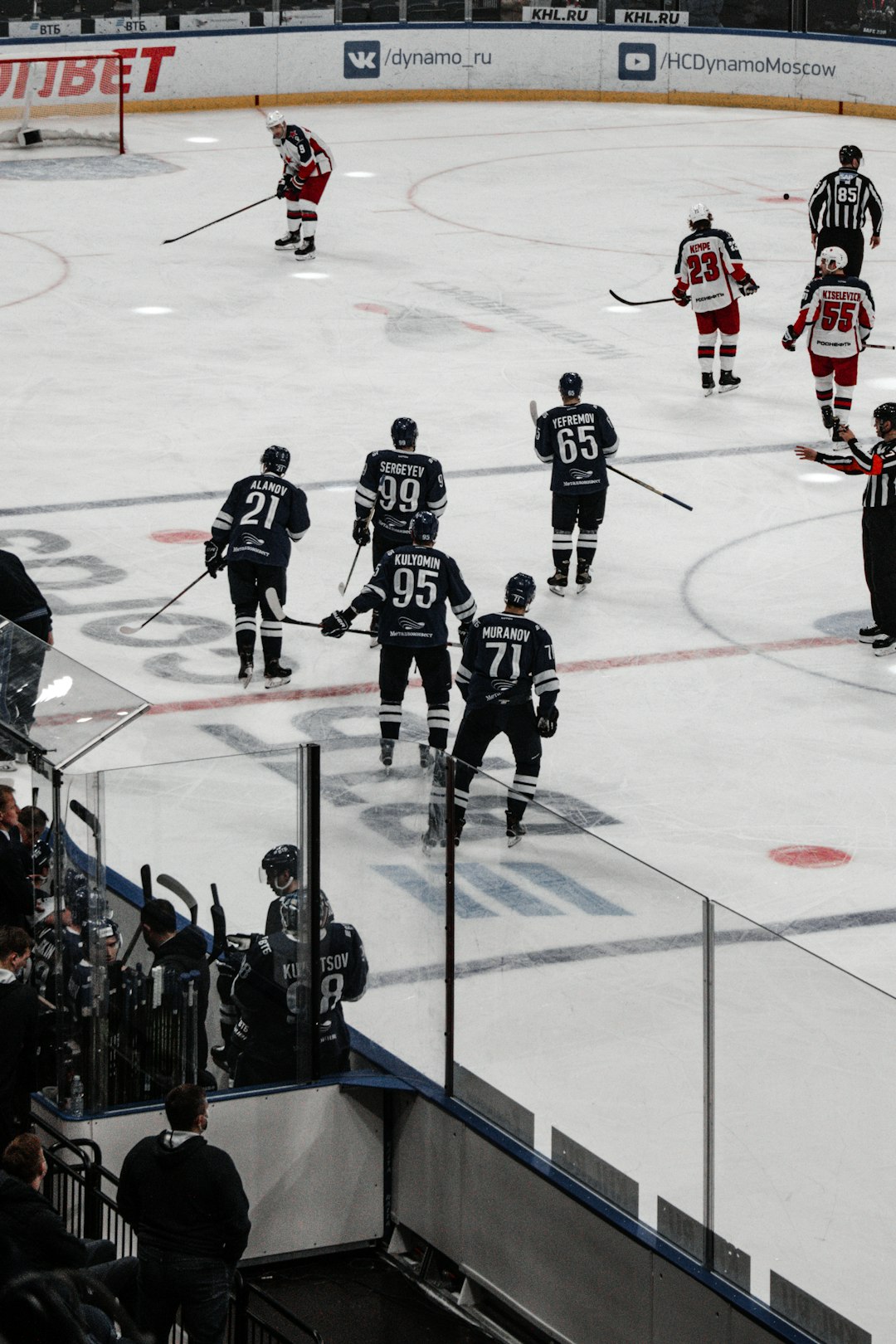 group of people playing ice hockey