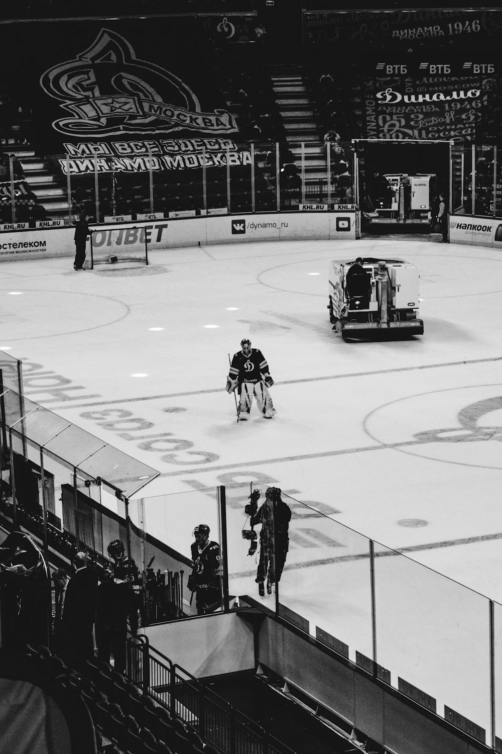 grayscale photo of people playing ice hockey