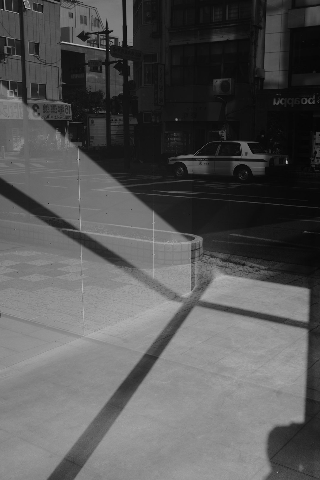 grayscale photo of cars on road