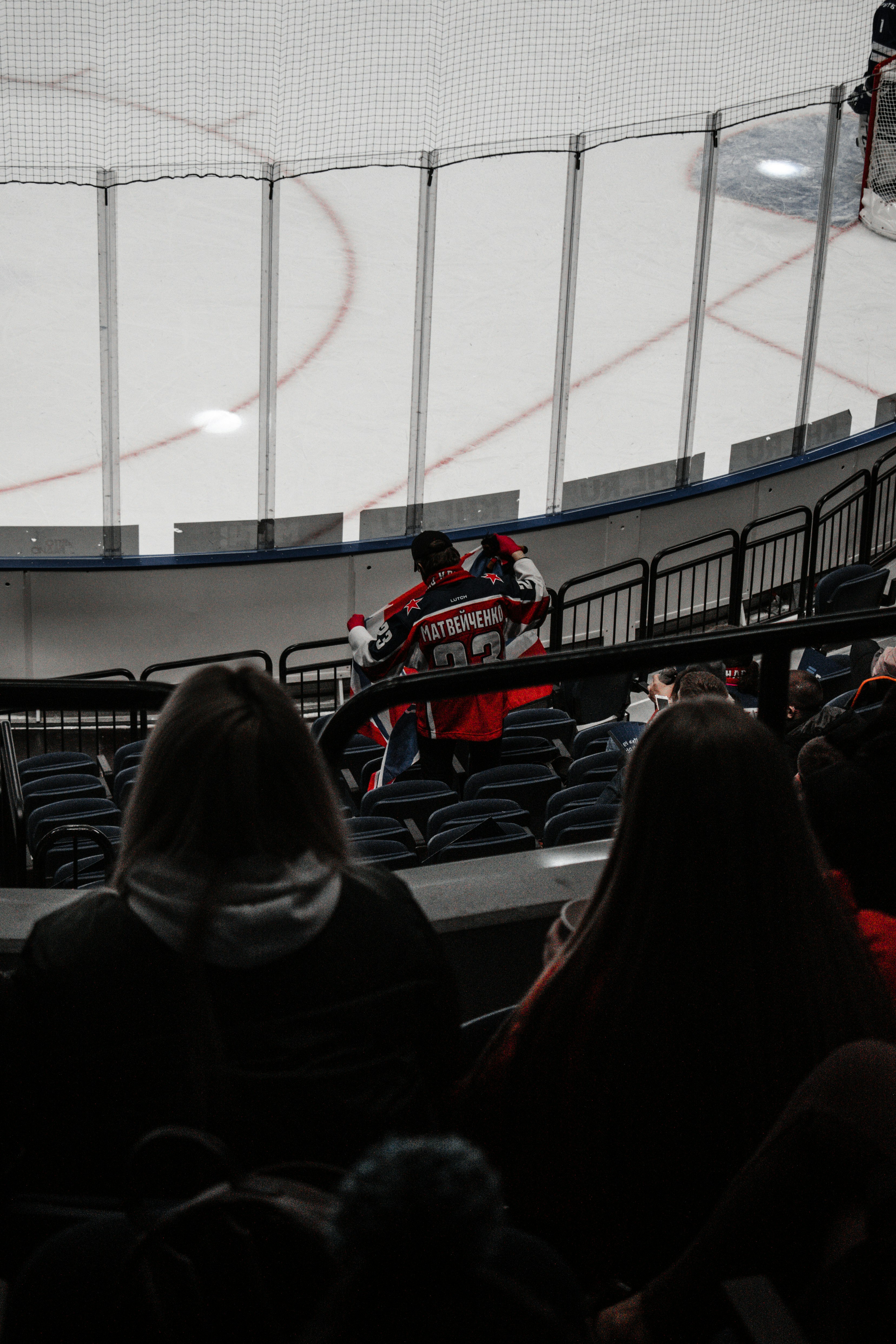 people sitting on stadium seats