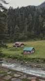 green and brown house on green grass field