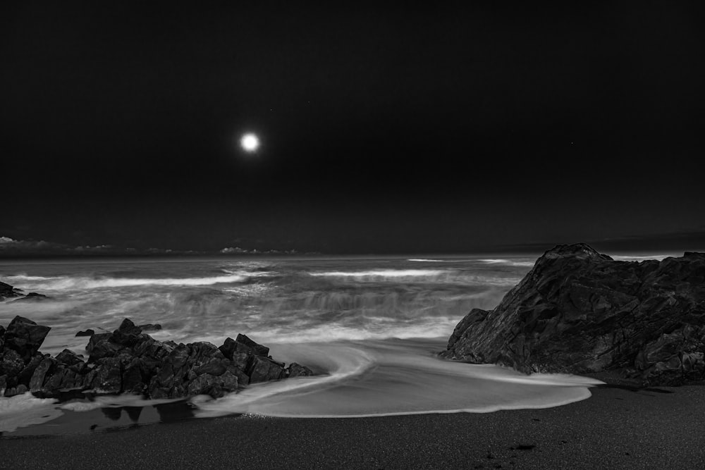 grayscale photo of beach shore