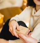 woman in white dress holding gold iphone 6