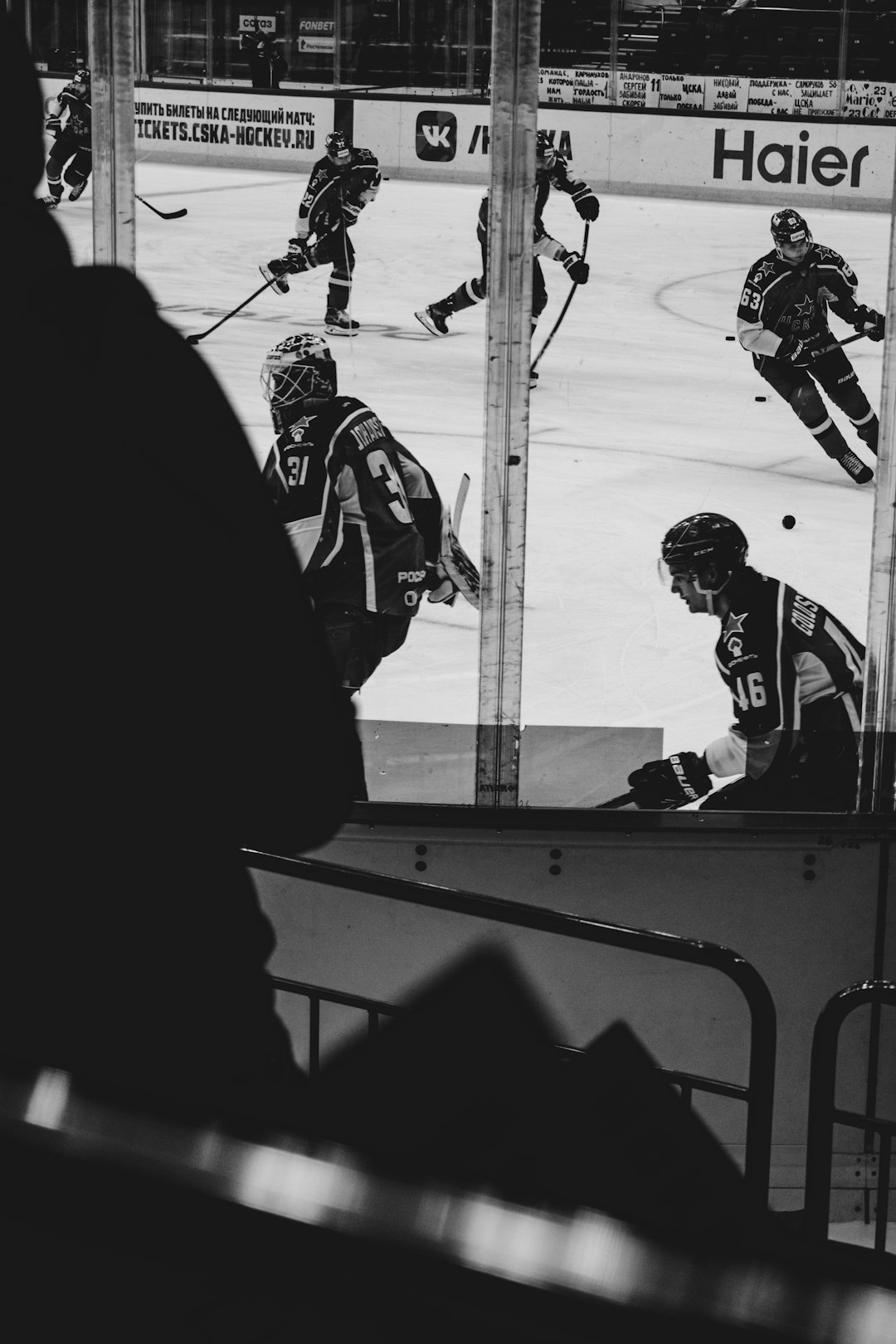 grayscale photo of 2 men playing hockey
