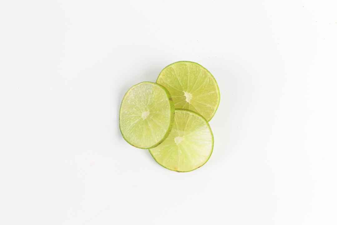 sliced lemon on white surface