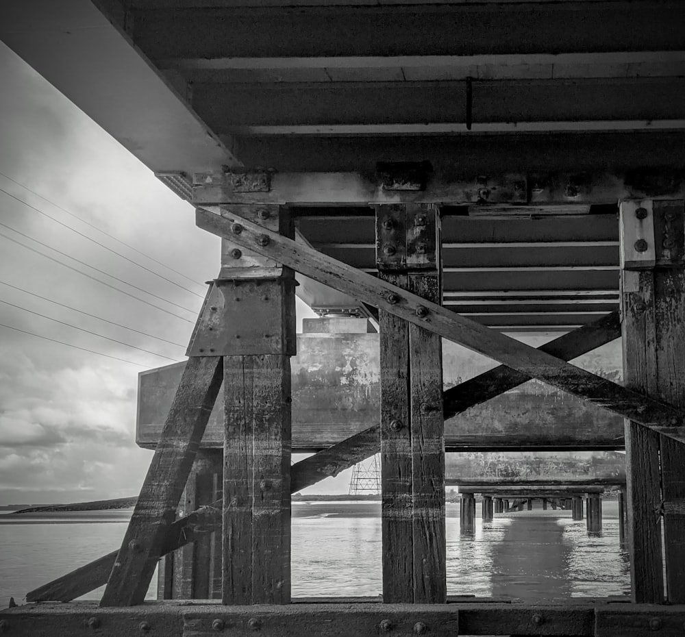 grayscale photo of bridge over river