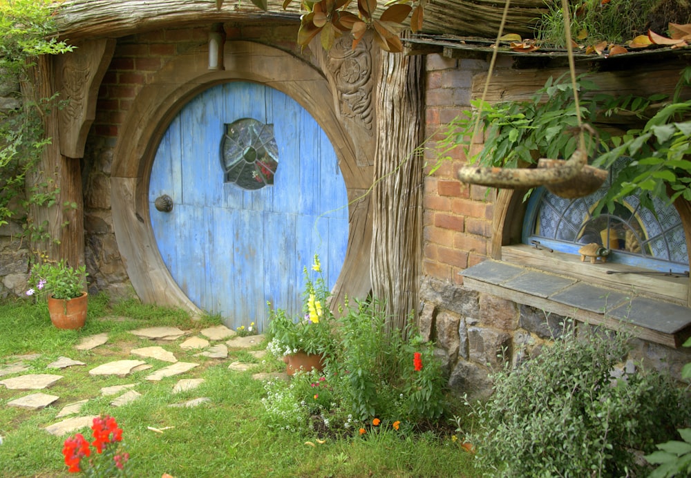 brown wooden door with red flowers